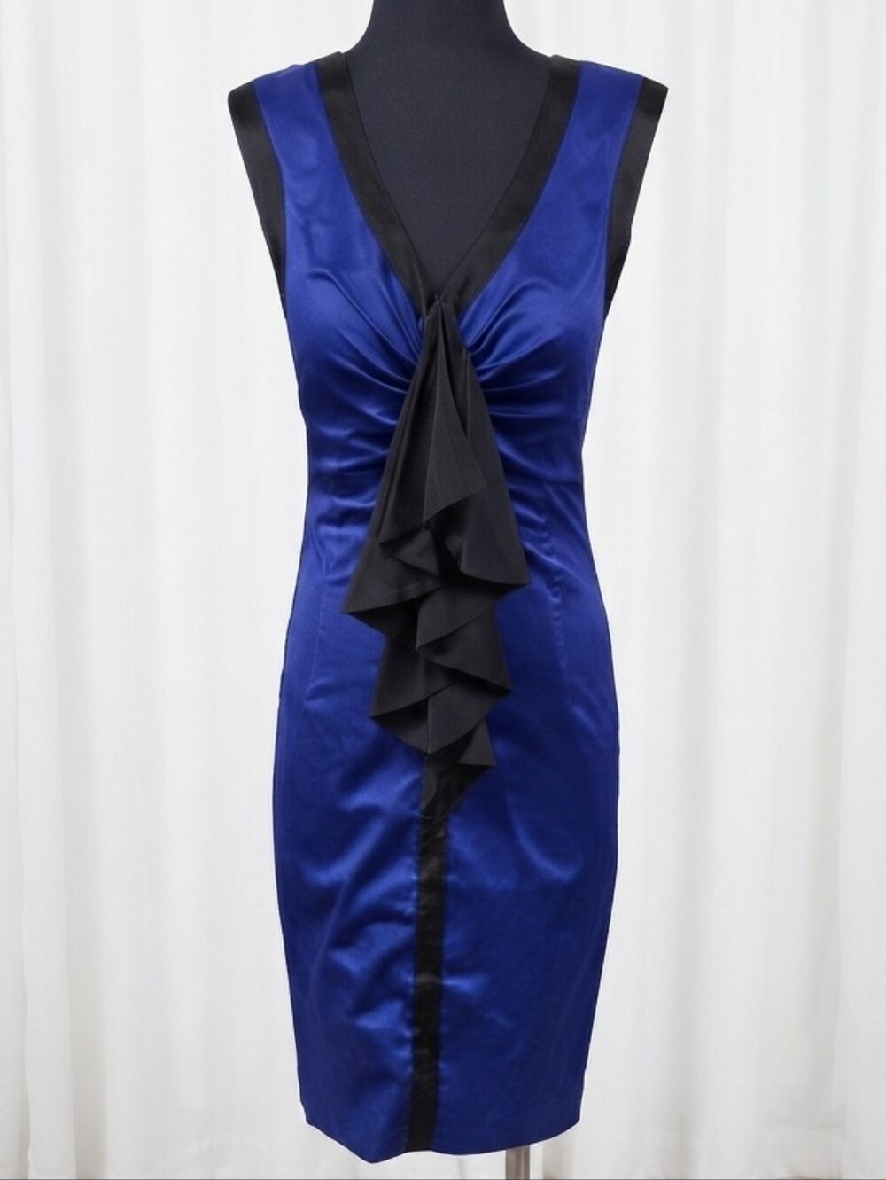 Ted Baker ruffle dress features a prominent black ruffle detail dress.